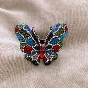 This & That butterfly stretch  cocktail ring w/Multi coloured stones.